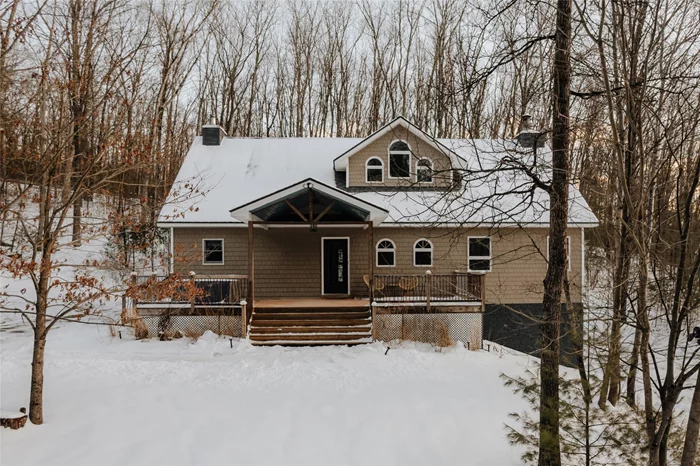 A spacious and unique Catskills retreat just minutes from Narrowsburgâ€™s popular amenities. Through the foyer, enter into an airy living space boasting soaring cathedral ceilings, a wood-burning fireplace, and a wall of windows that bathes the room in natural light. A staircase leads to the lofted second floor with a breezy lounge space, balcony, and French doors that open to one of the homeâ€™s three bedrooms. Back downstairs, the great room flows into an efficient kitchen. The first floor also features a convenient laundry/mudroom, full bathroom, guest bedroom, and first-floor primary suite, complete with a private exterior entrance and ensuite bath. Downstairs, a bonus finished walk-out basement - an additional approximately 1, 000 sqft - features another lounge area, gym, wet bar, second laundry room, two bonus rooms, and direct yard access. Outside, the five-acre property is surrounded by wooded land and features rocky outcroppings, seasonal stream, and a large garden shed. Just two hours from NYC.