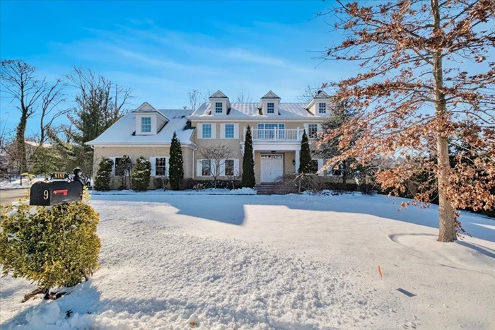 Welcome to 9 Downing Dr W, a stunning all-brick center hall colonial nestled on a private cul-de-sac. Step inside and be captivated by the grand double-entry foyer, featuring sweeping hardwood floors and sun-drenched interiors that create a warm and inviting atmosphere. The first floor boasts a spacious living room, a dining room adjacent to a stylish bar area, and a custom kitchen with ample counter space, stainless steel appliances, and granite countertops. The eat-in area opens to the deck and expansive backyard through sliding doors, showcasing a beautifully landscaped yard with well-manicured lawns, vibrant flowers, mature trees, and lush shrubs. Flowing seamlessly from the kitchen is a bright family room, which also connects to the living room and an office that can serve as a potential fifth bedroom, with a full bathroom conveniently located on this level for added functionality. A well-designed mudroom with ample cabinetry provides the perfect space to store all your shopping and everyday essentials. Upstairs, the primary suite features elegant tray ceilings, ample closet space, and a spacious en-suite bath. This level also includes three generously sized bedrooms, a full hall bath, and a convenient laundry room. A standout feature is the extensive storage throughout the home, including a large finished bonus space perfect for a playroom, office, or additional living area. The basement, with its high ceilings and sliding door to the backyard, offers endless possibilities for customization. With abundant storage throughout and beautiful hardwood floors enhancing every room, this home is designed for both comfort and style. Set on over half an acre, just minutes from White Plains, it provides easy access to shopping, restaurants, and trains to NYC.