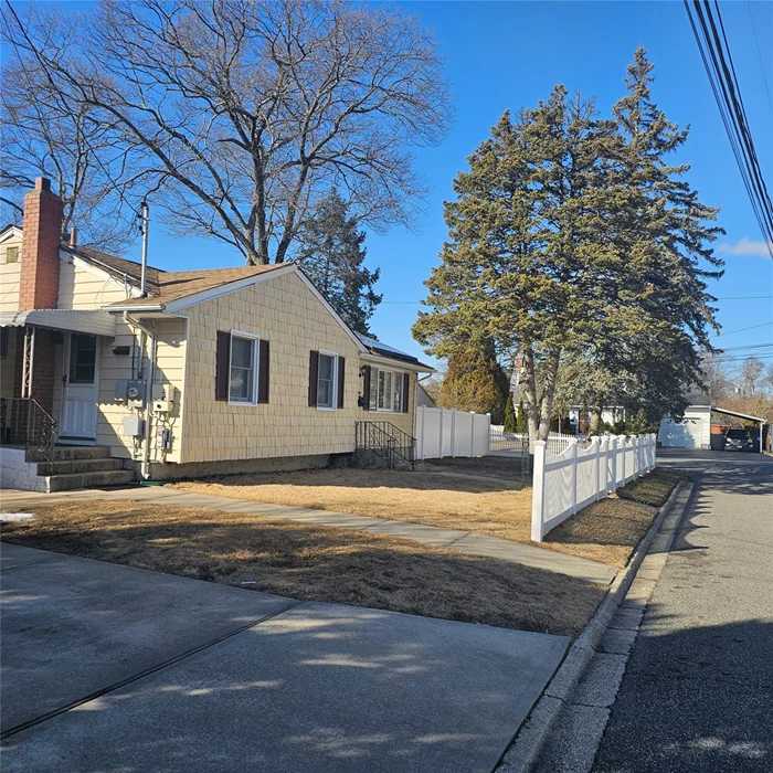 Welcome to this charming two-bedroom home nestled in the desirable North Babylon neighborhood. This property combines modern living with the comforts of suburban life, making it perfect for families, young professionals, or anyone seeking a peaceful retreat.Exterior:As you approach the house, you are greeted by a well-maintained front yard featuring lush greenery and colorful landscaping that enhances the curb appeal. The inviting aluminum siding and a welcoming front and side yards set the tone for the warmth inside. Nice street no overnight-parking restrictions offers ample parking space, leading to a one-car garage for additional convenience.Interior:Upon entering, you step into a bright, airy living room adorned with windows that fill the space with natural light. The cozy atmosphere is perfect for relaxing evenings or entertaining guests. The open floor plan seamlessly connects the living area to the dining space, which can comfortably accommodate family meals or dinner parties.The kitchen is a chef&rsquo;s delight, equipped with modern appliances, generous cabinetry, and sleek countertops. It features an adjacent breakfast nook, ideal for casual dining or morning coffee. Ample storage and workspace make this kitchen as functional as it is stylish.Bedrooms:The property boasts two spacious bedrooms, each designed with comfort in mind. The bedroom features a closet and offers enough room for a king-sized bed . Its serene color palette and soft carpeting create a soothing retreat at the end of the day. The second bedroom also provides generous space, perfect for guests, children, or a home office setup. Additional Features:All Utilities included. Outdoor Space:Step outside to discover a private backyard oasis, perfect for summer barbecues, gardening, or simply enjoying the outdoors. The fenced yard provides a safe space for children to play.Location:Located in North Babylon, this home is conveniently situated near shopping, dining, and recreational parks. The community is known for its friendly atmosphere and convenient access to major highways, making commuting a breeze. Schools in the area enjoy high ratings, adding to the appeal for families.In summary, this two-bedroom home in North Babylon offers a perfect blend of comfort, style, and convenience. Whether you&rsquo;re looking for a cozy family residence or a serene place to call your own, this property is ready to welcome you home.