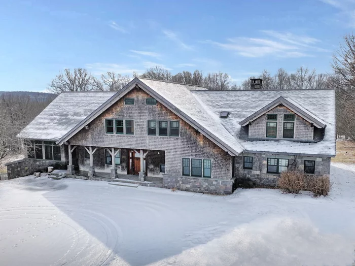 Set on 33 scenic acres, this expansive 6, 111 sq. ft. Craftsman-style estate seamlessly blends rustic charm with modern luxury. Featuring 4 bedrooms and 4.5 bathrooms, the home offers generous space for both relaxation and entertaining. The grand living area showcases soaring cathedral ceilings with hand-hewn beams, complemented by multiple fireplaces that create a warm, inviting ambiance. Designed for culinary enthusiasts, the gourmet kitchen boasts stainless steel Viking appliances, custom cabinetry, a spacious pantry, and a butlerâ€™s pantry for added convenience. The expansive basement offers endless possibilities. Equipped with barns and paddock, this property is ideal for equestrians, while a tranquil pond enhances the natural beauty of the landscape. Despite its private setting, the home is just minutes from local shops, top-rated schools, and the Campbell Hall train station for easy commuting.  While the property requires repairs, it presents a unique opportunity to restore and personalize a stunning estate to its full potential. Sold as-is. Buyer to pay NYS and any local transfer taxes. Cash and rehab loans only. Offers with financing must be accompanied by pre-qual letter; cash offers with proof of funds. **Please see agent remarks for access, showing instructions and offer presentation remarks.**