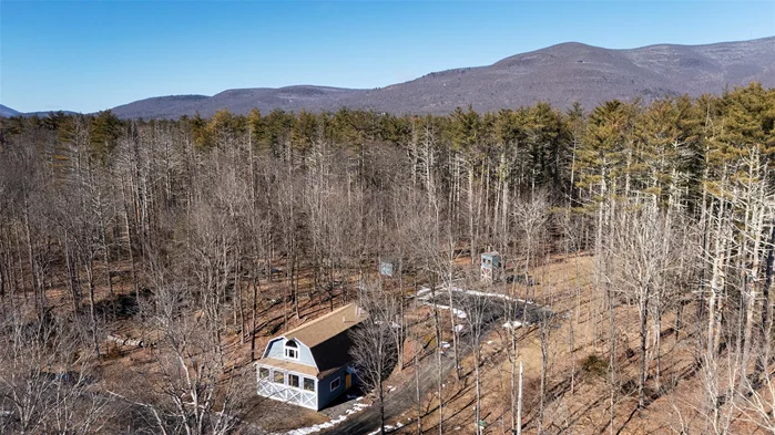 A One-of-a-Kind Renovated Barn & Creative Haven in WoodstockSet on three peaceful acres, this reimagined 1910 barn blends historic charm with modern comfort. Designed as both a unique home and an inspiring creative space, this property has been meticulously upgraded with radiant heating, all-new insulation, updated electrical and plumbing, and a newly installed leach field.Soaring ceilings on both levels create a spacious, airy feel, with a thoughtfully designed layout ideal for music, performance, dance, or studio use. The lower level features two cozy bedrooms, a full bathroom with laundry, and an open-concept living space with a kitchen, island, and reading nookâ€”topped off by a lofted resting area. A bridge from the upper lot leads to the barnâ€™s stunning second levelâ€”another expansive post-and-beam space currently used for massage therapy and musical experiences. This floor also includes a full bathroom, a mechanical room, and a versatile bonus room perfect for an office or additional sleeping area.Beyond the barn, the property offers a range of additional spaces. A rustic treehouse adds a whimsical retreat, while a tiny cabin provides even more possibilities as a writerâ€™s shed, studio, or guest space. A separate storage shed ensures ample space for equipment and gear. With R1 zoning and ample space further back on the lot, there is also potential for an additional building.Blending rustic character with contemporary updates, this is a rare opportunity for visionaries seeking a home that inspires. Ideally located just off historic Zena Road, itâ€™s a short drive to Woodstockâ€™s Village Green.