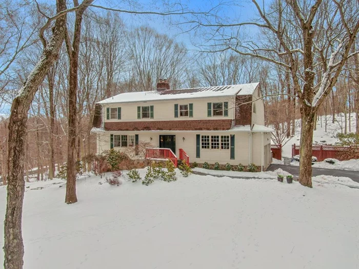 Perched perfectly on 2 acres with a private and level backyard in the Chappaqua school district. This stunning colonial home offers 5 bedrooms, 5 full bathrooms, and over 4, 400 sq ft of living space. Step inside the spacious entry hall to find a sunlit open floor plan with distinctive finishes and hardwood floors. The chefâ€™s kitchen, featuring a skylight over the large center island, and Viking appliances, seamlessly connects to the family room, dining area, and formal living room. The family room features a wood-burning fireplace, while the dining area has access to a mahogany deck and backyard. The first floor also provides flexible living space, including a home office (or additional bedroom), mudroom with garage access, laundry, and a full bath. Upstairs, the primary bedroom suite features two walk-in closets, an en-suite bath with double vanities, a jacuzzi tub, and a glass-enclosed shower. Three additional bedrooms and two more full bathrooms complete the upper level. The finished walk-out lower level has a playroom with another wood-burning fireplace, a full bathroom, and ample storage. Modern comforts include solar panels, central air conditioning, a whole-house generator, and a Tesla charger.