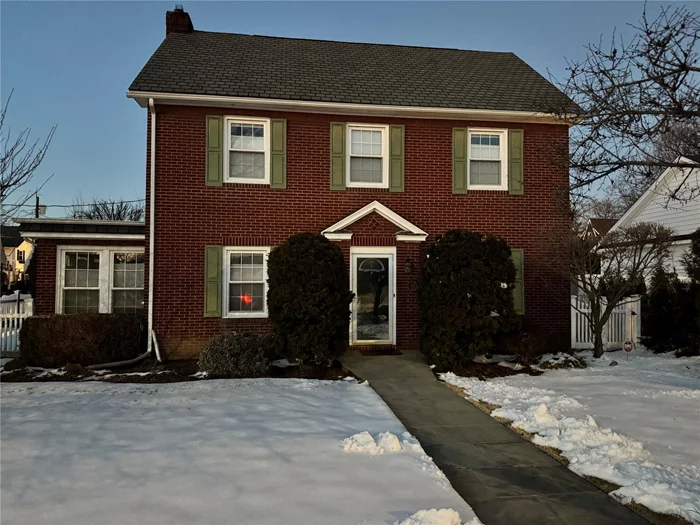 This charming 3-bedroom, 1.5-bathroom center hall colonial at 33 Capitolian Boulevard in Rockville Centre, NY, offers a blend of classic elegance and modern amenities. Built in 1926, the home features original banded oak parquet floors, new windows, and a new roof. The granite kitchen is equipped with stainless steel appliances, and the formal dining room provides a perfect space for entertaining. Additional highlights include a den, a finished basement playroom with laundry facilities, central air conditioning, and an attached garage. Situated in the top-ranked Hewitt Grammar School district, the property is conveniently located just a 33-minute commute to Manhattan. The monthly rent is $4, 500