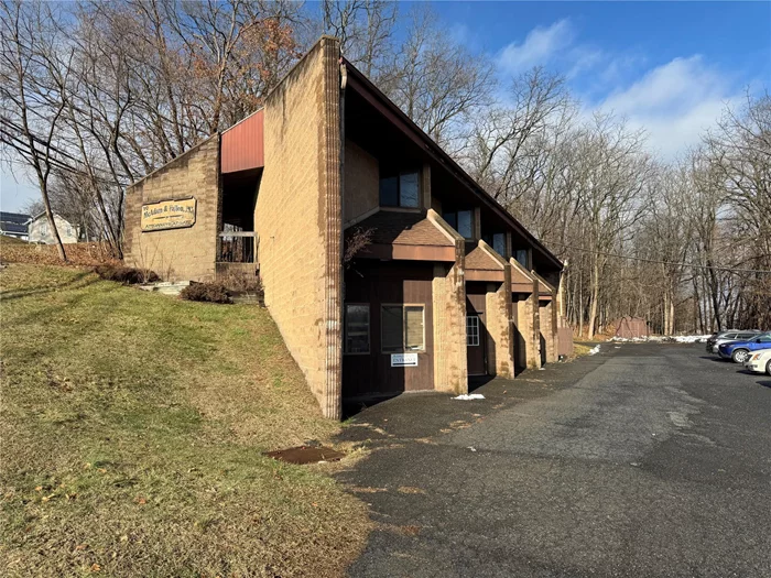 Spacious Office building with Entrance/Waiting room, LAW Offices, Library. Closing -Conference Room. Kitchen, Bathrooms on each level.Currently Law offices with Library - Closing / Conference Room with walls of Book shelves. Will be Vacant in March.