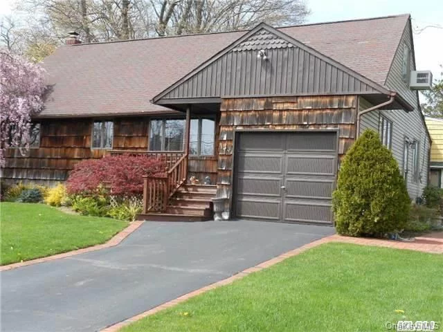 Charming & Spacious Cape! Step into this beautifully designed four-bedroom, 2.5-bathroom Cape that perfectly blends elegance and functionality. The open floor plan invites natural light to flow throughout, highlighting the gorgeous hardwood floors. The large kitchen is ideal for entertaining, offering plenty of space for meal prep and gatherings.This home also features a dedicated washer/dryer area, providing convenience for daily living. There is room for Mom, making it a great setup for extended family or guests. The decking creates the perfect outdoor retreat, relaxing in the charming gazebo, nestled in the beautifully maintained yard perfect spot for enjoying peaceful mornings or lively evening gatherings.complemented by durable Cedar and vinyl siding. Inground Sprinklers. Donâ€™t miss the opportunity to call this stunning home yours!