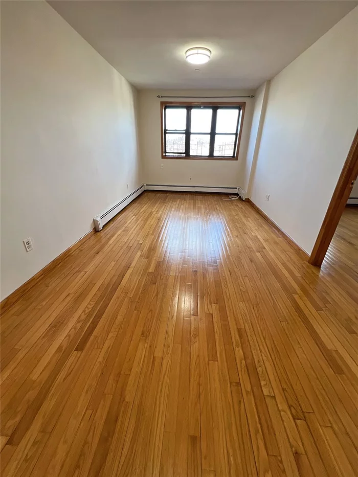 Sunny and Bright Large One Bedroom Apartment in the Heart of Corona, Spacious Living Room, Large Bedroom, Updated Kitchen and Bath. Hardwood Floor Throughout. Close Everything, Parking is available for extra fees. A Must See.