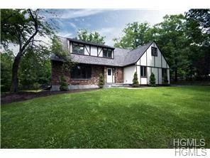 This Unique Tudor Inspired Colonial home sits on a beautiful one acre corner lot on a quiet Cul De Sac in the Town of Woodbury. The home was just completely renovated inside and out and is truly in move-in condition. The entrance level features a welcoming foyer, custom kitchen with granite counters, travertine backsplash and stainless steel appliances, a huge family room with room for a bar and a wood-burning fireplace encased by attractive cultured stone, sun-kissed formal living and dining rooms with hardwood floors, a lovely powder room and spacious pantry. Upstairs lies the master suite with attached office nook and stunning bathroom, three generously sized bedrooms and a full bath in the hall with laundry area. Pella windows, young roof, new doors, new paint , new fixtures, new electrical service and panel, new well and oil tanks, new and refinished flooring throughout, heated garage, central air, new landscaping, new driveway, fenced yard, tiered decking and more!