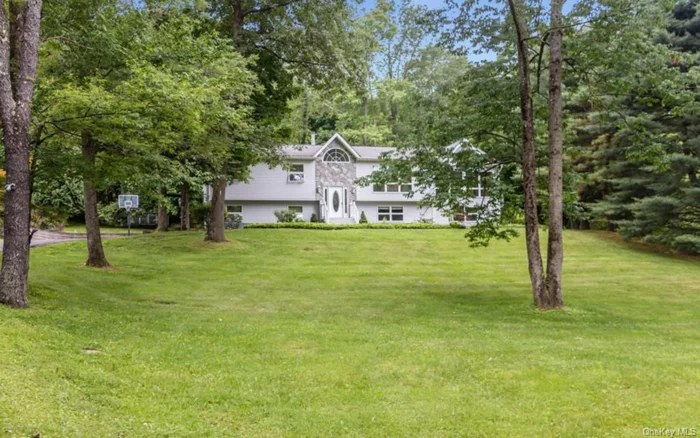 Bring the whole family to this stunning 4/5 bedroom 3 bath Mother/Daughter home with over 2800 sq feet just off a quiet country road yet still so close for commuters! Located in Woodbury which includes use of Woodbury parks, pools, and recreation yet has award winning Cornwall Schools!Surrounded by mountains and wooded privacy with a gorgeous back yard. Step inside and see for yourself how the open floor plan and natural light flows throughout the home. Sparkling hardwood floors on the main level. Four skylights and vaulted ceilings within the kitchen, dining room, and great room.  Custom cooks kitchen offers double wall oven, stainless steel applainces, granite counters, and custom cabinets. Sliding doors lead to an oversized deck.Master suite, guest bath and two guest bedrooms make up the main floor. The lower level features a kitchen, living area full bath and two bedrooms. Legal Mother Daughter! Upgrades include a newer roof and 3 year old furnace.