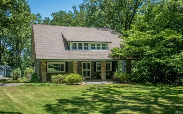 This gorgeous Arts & Crafts style home located in the desirable Oak Clove neighborhood has been meticulously renovated & maintained. The expansive living room provides a formal area for traditional furnishings & entertaining. Wooden beams & a beautiful stone fireplace make this large room feel warm & cozy. The formal dining room has original built ins to display your finest dinnerware. The renovated kitchen with pine cabinets, unpolished granite countertops, Wolfe stove, stainless steel appliances, farm style sink, built in china cabinet & walk in pantry keeps the space traditional with all the modern conveniences. The family room has vaulted ceilings & large windows keeping the room sun filled all day. The second floor has an oversized hallway with built in bookcases that lead to 4 generous size bedrooms. The hall bath has also been renovated with a whirlpool tub and granite countertops. A large deck overlooks a private, level back yard with mature trees. Minutes to Woodbury Commons!