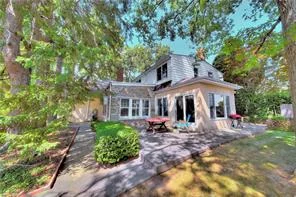 Expansive Colonial on landscaped lot has fanlight front door and entry way with stone fireplace. Near the entryway is a full-sized dining room and sunny and airy living room with doors to the patio. The functional layout has the laundry room and large pantry near the kitchen. A good sized bedroom and full bath are on the 1st floor. The 2nd floor has 3 full sized bedrooms, windowed storage room, and 2 full-sized baths. An ensuite sitting area with skylights and bath in the 1st bedroom creates a magnificent space. The 2nd bedroom with high ceilings has extra space for a study area. Views of trees and lawn enhance the large 3rd bedroom. All have hardwood floors. Parking is a breeze     in the 2 car attached garage and the long driveway can accommodate 2 more cars. In good condition, the house is priced for your own custom touches. On a friendly tree-lined street there is easy access to buses and trains, one-of-a-kind shops, urban shopping areas, restaurants, and Wave Hill.