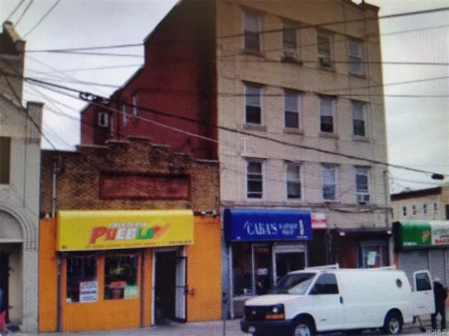 TWO BUILDINGS BEING SOLD TOGETHER. INDIVIDUAL MULTI USE SINGLE LEVEL AS WELL AS FOUR LEVEL BUILDING. LARGE BUILDING HAS TWO STORE FRONTS AS WELL AS FIVE RAILROAD STYLE APARTMENTS. (4) 2 BEDROOM UNITS TOP FLOOR IS A SIX BEDROOM 2 FULL BATH UNIT. STREET PARKING.