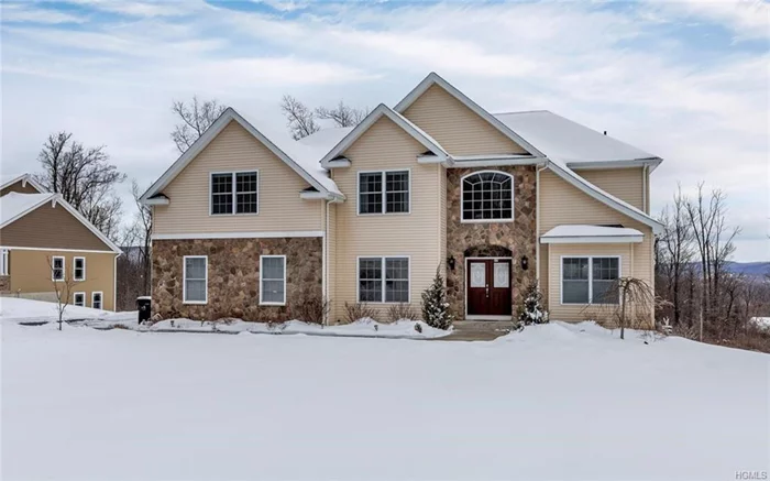 Great flow and open floor plan in this gorgeous Woodbury Junction colonial with over 3200sf of living space and a welcoming 2 story entry built on one of the nicest lots in the development. There is a first floor office with full bath, large eat-in-kitchen with granite countertops, tile backsplash and stainless steel appliances. Sliding glass doors lead from both the kitchen and family rooms to a 24x18 deck that overlooks private park-like property. Off the kitchen is the magnificent family room with gas fireplace, 18ft ceiling and a glorious full wall of windows. H/W floors throughout. Master suite has two large walk-in closets and a tranquil sitting area. Spacious master bath with double vanities and jacuzzi tub. There are three additional spacious bedrooms and full bath upstairs. The walk-out basement has 10ft ceilings and is rough plumbed and ready to be finished. 2-car garage and 11 zone sprinkler system. The mountain views from this home are breathtaking. Located 1 hour to NYC.