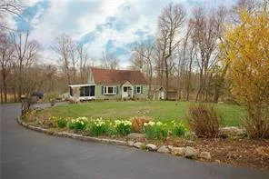 This charming and sparkly Cape is beautifully appointed with artistic flair and a concern for comfort. Set in a gardener&rsquo;s paradise of perennial borders, berry bushes and mature shrubs, it also offers a vegetable plot and garden shed. The sunny eat-in kitchen is updated with granite counter tops, farm sink, tile floor and stainless steel appliances. French doors lead to a small deck and down to a wide stone patio, ideal for summer dining and gatherings. The living room has a large bay window, letting in an abundance of light. A formal dining room, an updated hall bath and a bedroom conclude the first floor. Upstairs you will find the serene Master bedroom with its wall of closets and built-ins, the third bedroom, an updated hall bath, as well as a small study/office. All rooms are freshly painted and there are hardwood floors through out. The large, walk-out unfinished basement houses an artist&rsquo;s studio, a laundry area, and provides plenty of storage. A wonderful house to call home.