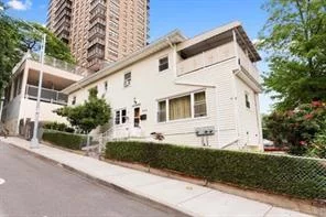 This 2 story, Two-Family vinyl over brick house with garage, built on 25&rsquo;+/- x 86&rsquo;+/- lot is situated on a dead end street on the corner of West 238th St & Irwin Ave in the quiet neighborhood of Kingsbridge with plenty of area amenities. The home offers 3 bedrooms and 2 full bathrooms (2 bedroom duplex over a 1 bedroom simplex on the 1st floor). The duplex boasts an Enclosed Balcony off the master bedroom. The 1st floor apartment has access to a Backyard Patio. Recent updates include a new bathroom and kitchen cabinets in the duplex installed this year as well as a new roof in 2008. 3, 805+/- square feet of air rights remaining! Can Be Delivered Vacant. A short walk to the #1 train and the Broadway Plaza Mega-Mall at W238th St & Broadway as well as to Van Courtland Park. Conveniently located off the Major Deegan at Van Courtland Park south exit as well as the Henry Hudson Parkway.