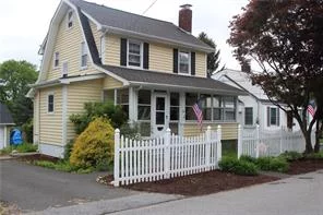 Come see this spacious two story colonial home that sits on a 100 x 100 leveled property. Home has a fantastic curb appeal. This home features an enclosed front sun porch where you can relax. Open the front door and enter into a spacious living room with a fireplace. Enjoy entertaining in a spacious dining room with direct access to a large eat in kitchen. A door off the kitchen leads to the side porch large enough to fit BBQ and patio furniture. There is a full bathroom on the main floor that has been updated. The upper level has another full size bathroom, and three bedrooms. Pull down the stairs and you have a huge partially finished attic for storage and more. A finished basement with plenty of storage. A must see to appreciate!