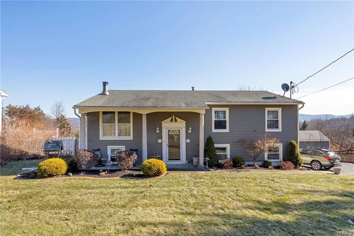 This impeccably kept inviting home beckons to you as soon as you enter. The warm ambiance created by the floor to ceiling stone fireplace in the living room sets the pace to relax & stay a while. Crown moldings, recessed lighting, hardwood floors, french doors, updated kitchen cabinets, wainscoting, tiled backsplash and floor create an atmosphere of comfort & style. The Jack & Jill bathroom is completely updated and pleasing to the eye. The option of a master bedroom upstairs or on the lower level offers versatility. 3 bedrooms upstairs & one bedroom on the lower level plus a lower level full updated bathroom, family room, exercise room, & utility/laundry room offer additional space for living & sleeping. A new Buderus heating system with 4 zones helps keep heating costs down. 2 sheds, fenced in yard, composite deck with mountain views & front porch offer options for outside use. Woodbury recreation, Monroe-Woodbury award winning schools, close to West Point and train to NYC.