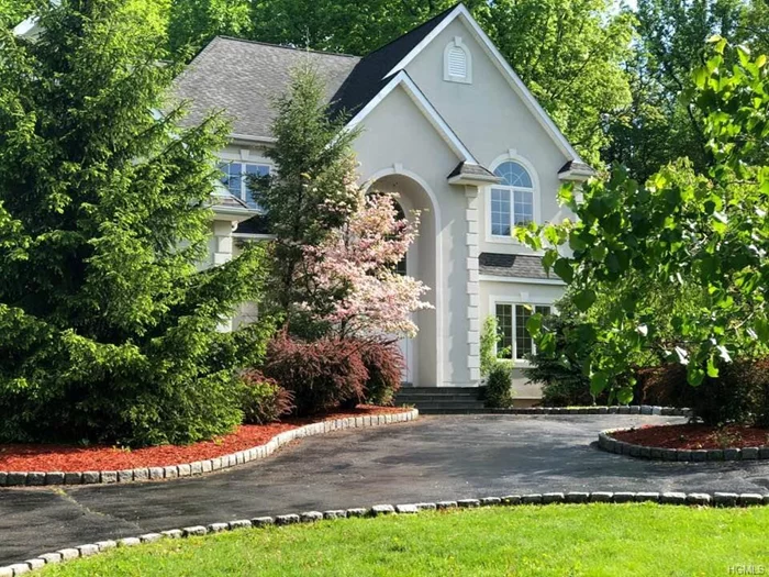 Welcome home! Step right into to your magnificent center hall colonial located in the prestigious Greens of Woodbury. Pull right up to your circular drive with plush landscaping and Belgium block and then enter through your double doors to a grand entrance of beautiful palladium windows and a custom chandelier. As you enter find your formal dining room and office with French doors and front balcony. Next walk into your sunken great room with 16 foot windows and fireplace topped with a two-story mirror and a wet bar for entertaining. Continue on to your bright and open custom kitchen w/ Corian counters,  Sub-Zero Ref, and Bosch DW. Work your way up to your double door entry master suite with huge California closet , ensuite bathroom and addt&rsquo;l three bedrooms .4 Zone Heat , 2 Zone AC and huge basement waiting to be finished . HW* Alarm System* Central Vac* Speaker System installed * NOTHING SPARED!! Municipal S&W *MW Schools *Close to I87 * Sure to sell at this price !