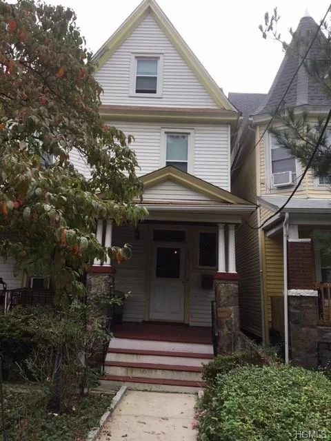 HAS AN ACCEPTED OFFER- no showings at this time. Seller had to repair a gas leak. Con Ed has to sign off on repair. That is the reason why the deal is taking some time. Spacious colonial single family high ceiling home in good condition. First floor has a large living room, formal dining room, renovated, updated kitchen, front porch, and a half bathroom. Second floor features 3 bedrooms, with a full bath. Attic has 2 large finished rooms. Basement is unfinished with lots of storage. Roof and boiler are in great condition. Property has a front porch and an enclosed back porch and a large fenced backyard with an above ground swimming pool. Property is located north of Riverdale near downtown Yonkers water front development, which has lots of shopping, restaurants, etc. Close to buses, trains, Tibbet Brooks Park, Cross County Mall, Empire Casino, parkways and is half an hour from mid town Manhattan via Metro North. SELLING &rsquo;AS IS
