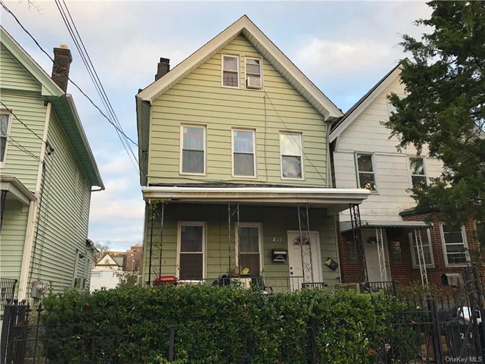 Fixer upper on a quiet street close to local amenities and awaiting a new owner to bring it back. 2 bedroom unit over a 1 bedroom, second floor also has a walkup to finished 3rd level. Porch, level rear yard, hardwoods, good bones and lots of potential. Priced to reflect condition.