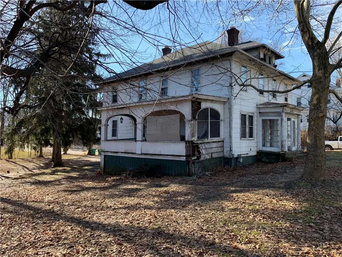 Rare DOUBLE Lot in the Heart Of Beacon!  Turn of Century Multi-Family w/ original Wood Work, doors, staircase, fireplace, Mantels intact. Needs Full Renovation Detached Garage Sold with Full Empty .13 acre Lot Next Door. CASH ONLY- AS IS