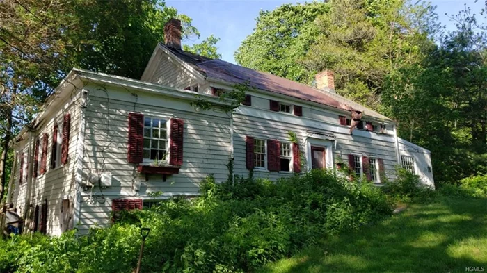 Massive Price Reduction! Move fast - will not last. Incredible price for this vintage early 1800&rsquo;s eyebrow Colonial close to Lake Mahopac -just waiting for a connoisseur of historic architecture to restore this classic back to its original glory. Much of the original historic fabric remains, including wideboard floors, exposed hand-hewn beams, trim, doors, and most hardware, with some additional renovations over the years. Two 1st floor bedrooms in one-story addition to left; eat-in kitchen & walk-in pantry in addition to right. Original center hall colonial has living room and rear parlor to left, dining room and full bath to right. Second floor has master bedroom with cathedral ceilings to left, and second bedroom and full bath to right. Two fireplaces. Rear covered porch. Expansive front yard. Many recreation opportunities close by, with swimming, fishing and water sports available just down the block at Lake Mahopac, as well as hiking/bike trails, golf, tennis and playgrounds. Easily accessible to NYC.