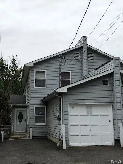 Affordable two family home with an attached garage and parking for 4 cars. Large level backyard 26x156 goes beyond the fence. Low rents due to family related tenants. Property can be delivered vacant. 1st unit is a duplex, featuring 3 bedrooms 1.5 baths, EIK, PR, dining room area with door to porch. 2nd unit- ground level, living room, modern kitchen and bathroom, large bedroom.  Great for first time buyers or investors!