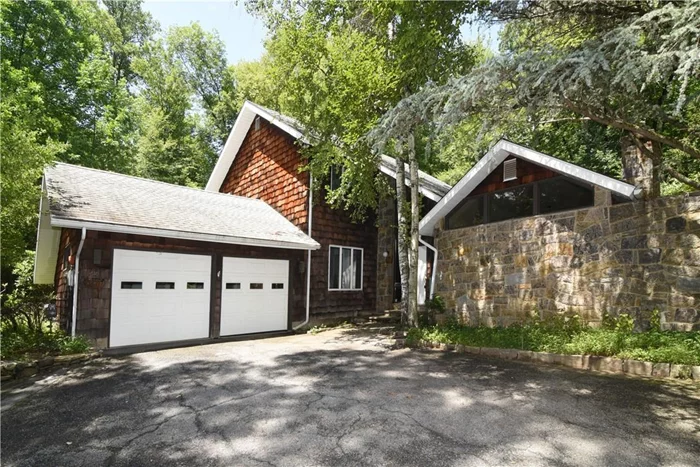 Spacious 3 Bedroom home with open floor plan situated on a cul-de-sac street. The house sits back from a long driveway and has great privacy. Property abuts Blue Mountain Reservation for a beautiful surrounding. Large bluestone patio and slate walkways on level side and rear yard overlooking wooded property. Formal Dining Room great for entertaining, Family room is adjacent to the Eat-in kitchen with plenty of counter space and easy access to patio and backyard though double SGD. Bright formal living room with second fireplace and vaulted ceilings. Natural gas generator to back up electric power. Attached 2 car garage, full unfinished basement.  Min to train and easy commute to NYC on Metro North. Close to Rt 9, town pool & recreation. entire house has been freshly painted and carpets professionally cleaned. Owner is paying for the lawn and snow removal services.