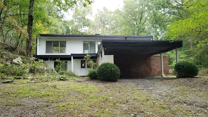 Custom Contemporary. Secluded setting surrounded by 2 acres of nature. Once a totally groovy and happening pad awaits its metamorphosis into the updated classic it is now meant to be. Most of the ingredients are there already. You bring the rest.