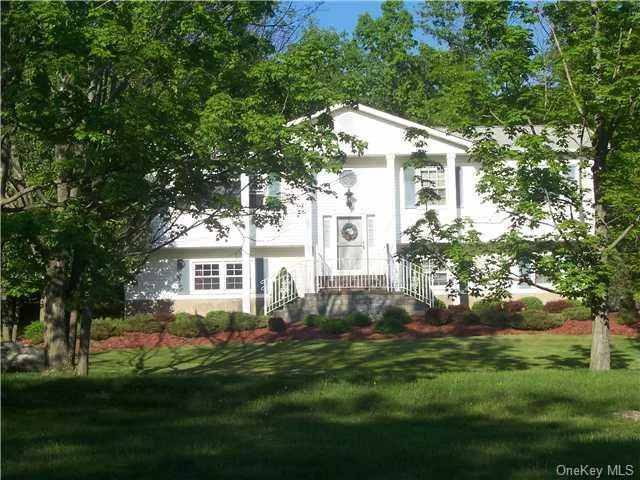 Home perched on hill overlooking pond across the way with Schunnemunk Mountain as backdrop. Walk inside and see how this home has been loved & meticulously cared for. Over-sized floor plan filled with light. Large room sizes will accommodate any size furniture. Gorgeous kitchen has brand new stainless steel appliances and granite counter tops. Updated bathroom with beautiful finishes. Woodbury Recreation is right down the street for your enjoyment. Super close to shopping & an easy commuter location. Owners are very flexible regarding quick closing. Enjoy the summer here and be in by school. You must add this to your list. No guess work on price, appraisal done! NOT A SHORT SALE!