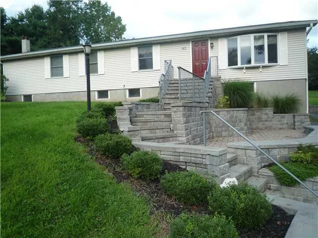 This 4 bedroom 2 bath Woodbury Ranch is situated on over 1.2 private, beautiful, level, useable acres! Interior features include a wide open floor plan with vaulted ceilings, full basement with a wood burning stove & 1/2 bath, kitchen with granite countertops, formal dining room, new main bath with imported tile and granite countertops, spacious bedrooms, master bedroom boasts a private bath with glass shower/spa with steam jets, tile and granite counters! 2 car garage, an oversized cedar deck, 5 minute walk to Shortline bus, 5 miles to Metro North train station, and walking distance to downtown Highland Mills! Town pool & Woodbury Recreation.