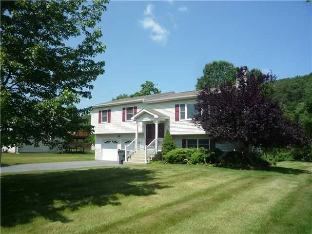 Private setting within the Valley Forge subdivision. This home is in perfect condition with vaulted ceilings, hardwood floors, central air, updated kitchen including granite counters. Master bedroom has full bathroom. The lower level has a family room a fireplace and a additional room perfect for an office or 4th bedroom with French wood doors. Large deck overlooking the private yard also included is an above ground pool for the summer enjoyment. Close to mass transit, Woodbury commons and West Point.