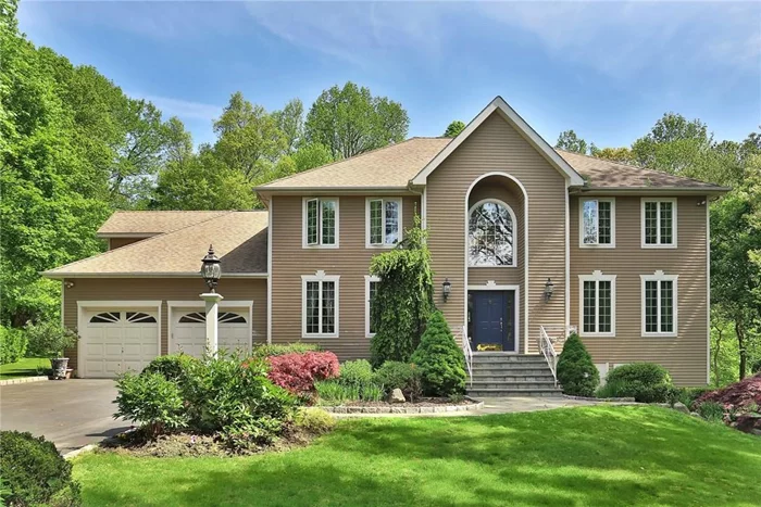 Gracious sun-filled Center Hall Colonial on a private, beautifully landscaped property. This classic modern open layout with spectacular grand entry has over sized rooms lined with large windows, 9 ft ceilings, crown molding & gorgeous hardwood fls. The kitchen has granite counters, Viking cook-top, double ovens, center island with marble top, and Travertine Versailles tile floor. The 2nd floor boasts 4 large bdrms, which include a master bedroom with en-suite & tray ceiling, 1 of the bedrooms is being used as a home office. Entertain in style in the elegant formal dining rm, formal living rm and spacious family rm. French doors lead out to a large slate patio & spectacular yard lined with stone walls, walkways & a Lord & Burnham greenhouse. The basement is 1, 600sq ft, not in total sq.ft, has private entrance and patio. This space can be used for in-laws, Au Pair, or recreation space.