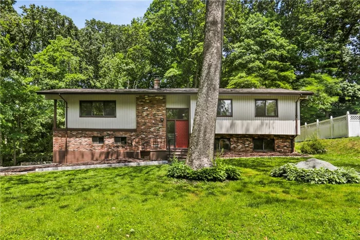 Peace & Relaxation await you at this Beautifully Renovated 5 Bedroom Raised Ranch on a lovely private lot, adjacent to babbling brook ..just minutes to Cortlandt Town Center & Metro North. Upper level boasts sparkling new gourmet eat in kitchen w/quartzite counters, sliders to deck, newly refinished hardwoods, over sized family room w/high ceilings, separate dining room, updated hall/master bath and 3 bedrooms. Lower level has large family room w/wood burning fireplace, 2 additional bedrooms, updated full bath and new carpet throughout. Exterior has great curb appeal with long newly paved driveway, stone wall and brand new roof. ****AO please show for backup **