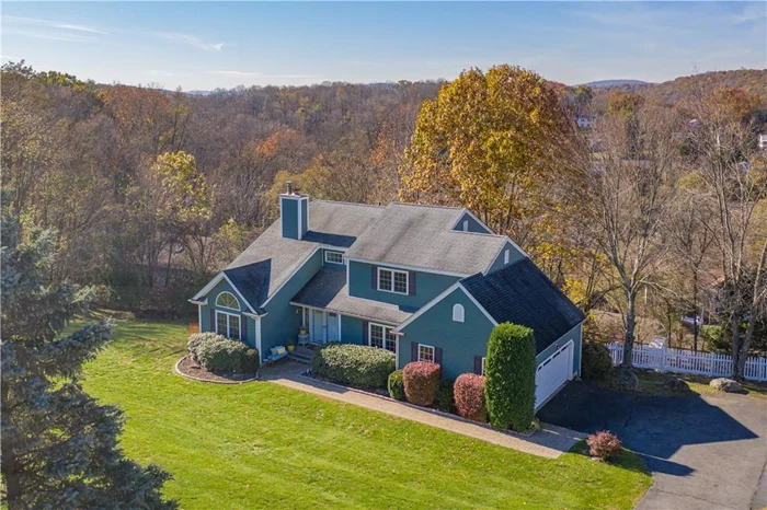 Make this beautiful home in Cortlandt Manor your new home. Lots of curb appeal and a quick drive to the Metro North. From the beautifully landscaped front yard to the peaceful fenced back yard you will fall in love. Inviting two story foyer with beautiful hardwood floors which extend into the formal dining room. The recently renovated kitchen boasts a 6 foot granite island and a gorgeous backsplash. Sliding glass doors from the eat in kitchen and the family room take you to the deck which spans both spaces and is under a canopy of trees. Enjoy magnificent views of the hills from the deck.  The Palladium windows in the living room with its vaulted ceiling makes it a delightful and sunny space. The wood burning double fireplace lends warmth to both the living room and the family room. The master bedroom suite has 2 walk in closets, a lovely bathroom with skylights. There is a beautiful hall bathroom and three large bedrooms with spacious closets. The walkout basement is a great space, there is a wine cellar, a huge office, room for a ping pong table and for just hanging out with friends and family. There is also a huge of storage room on this level.  This is a great place to call home. STAR DISCOUNT = $2135.