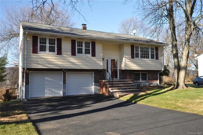 This beautifully remodeled, 3 Bedroom, 2 Full Bath Bi-Level is waiting for you! The new redesigned kitchen has an open floor plan equipped with Tall Cabinets, Granite Counter Tops, Stainless Steal Appliances, and is highlighted around a decorative Center Island. The Glass Sliders leads out to the enormous 15ft X 30ft Deck that overlooks your private back yard. The Family Room will accommodate your largest furniture set and is the perfect place to get away from it all. You can step out through the new back entrance that leads to the Slate Patio and Second Decking area.