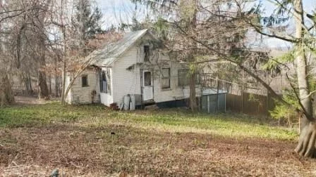 Summer cottage ready to be brought back to life. Situated on wooded .25 acre and close to everything. Community pool and playground could be utilized (reasonable annual fee). Neighboring cottage at 115 Redwood St., in similar condition, is also available. Package deal for both is an option.