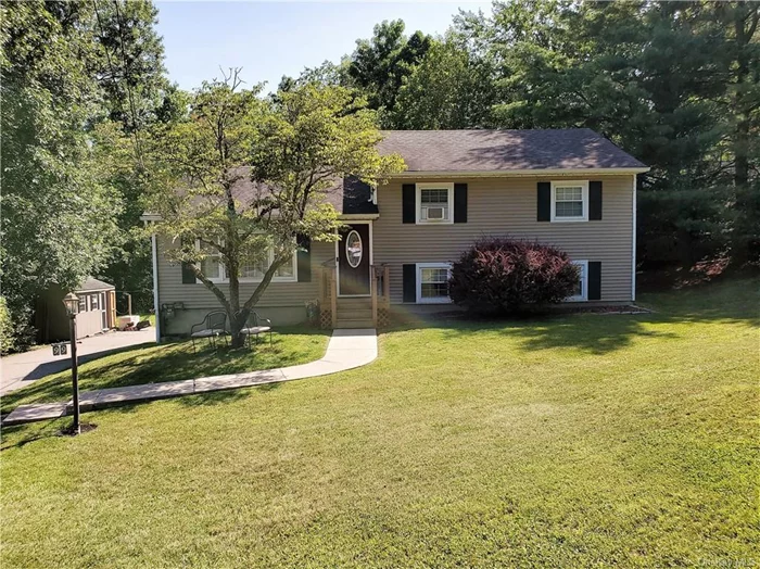 This split level has an updated kitchen with Granite counters Stainless steel appliances glass tiled backsplash and pot filler above the upgraded range. Bright airy living room, three nice bedrooms and two bathrooms. The lower lever has a large family room and laundry room. There are hard wood floors on the main and bedroom levels. Updated boiler with radiant heat on the main floor. Newer windows and siding. Enjoy the Woodbury Rec center, minutes to the highway.