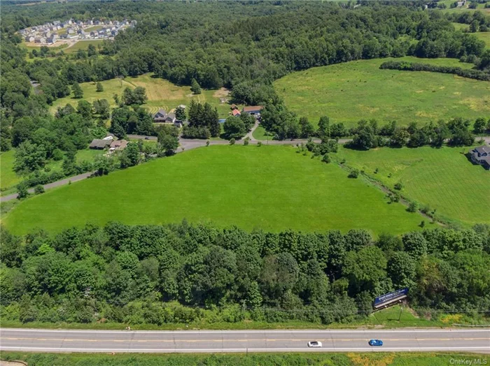 Looking north with Route 17M in the foreground. Property is bordered by Duck Farm Road on the left and Old Chester Road in the distance. Property is left of the Otterkill, seen here on right.