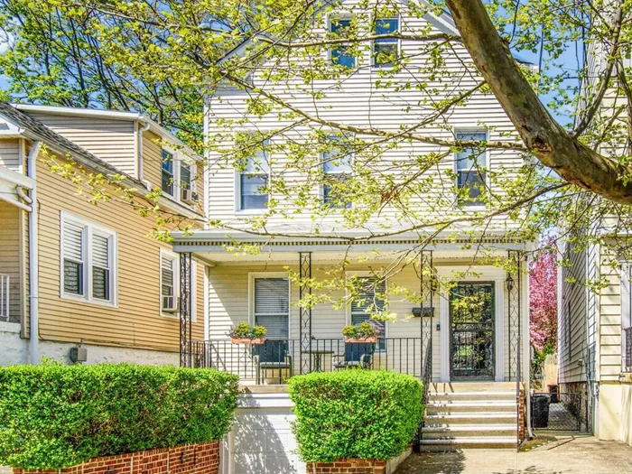 MOVE IN READY  Meticulously maintained detached side hall colonial home conveniently located in the desirable Woodlawn section of the North Bronx. This sun-drenched 5 bedroom, 1.5 bath home has been beautifully updated. The first floor, with high ceilings and gorgeous hardwood floors, opens to an inviting entry way adjacent to large living room, formal dining room and remodeled eat in kitchen with stainless steel appliances, granite countertops and abundant storage. Sliding glass doors off dining room lead to private deck and expansive patio for entertaining and gardening. Second floor has four bright bedrooms, gorgeous renovated full bath and ample closets throughout. Walk-up third floor offers charming bedroom and large closet. Additional semi finished third floor storage space perfect for another bedroom with bath, office or playroom. Inviting covered front porch, attached garage, large storage basement and driveway complete this lovely home. House is zoned as a two family property. Commuters dream, just blocks to Metro North, #4 train, buses, parks, and shopping. Low taxes A MUST SEE!!