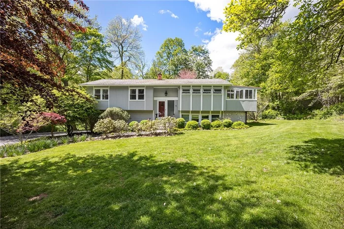 Mid-century contemporary style home surrounded by privacy and natural beauty with its mature and flowering trees! This fabulous home features a great flow for entertaining inside and out and offers all bright and airy rooms, high ceilings, walls of glass, skylights, HW floors, huge updated kitchen w/ breakfast counter & large additional room w/ access out to the multi-tier expansive Trex decking surrounding the area around the 18x33 pool 3-6.5 ft deep. Huge living room opens in to the relaxing 3 season room w/ dr out to the decking is an added plus. The main bedroom suite has a charming balcony overlooking the tranquil grounds and also offers a spa bath w/double vanity, soaking tub & dbl shower. The lower level offers a large Rec Rm with brick feature wall & a wood burning fireplace, 4th Bedroom and a half bath. New features and upgrades totaling over $25k include new septic tank/fields, generator hook up, brand new pool liner being installed, dog run, new carpet in LL. Newer roof and oil burner, large driveway that can accommodate 12+ cars, cul-de-sac location and conveniently located to shopping, highway, Metro-North w/ ez commute to NYC.