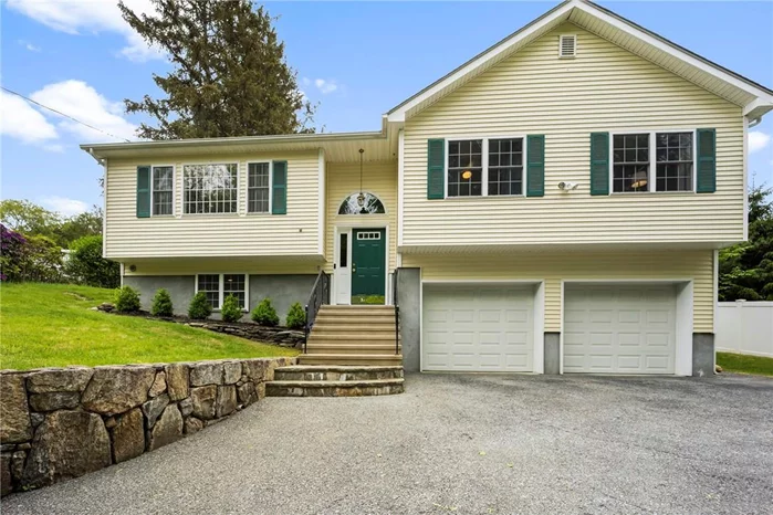 Welcome home to this beautiful move-in ready three bedroom Raised Ranch in Cortlandt Manor NY. Enter through the front door and be amazed by this open floorplan with crown molding, recessed lighting and beautiful hardwood flooring throughout the 1st floor. Living Room, dining room and eat-in kitchen with stainless steel appliances. Three spacious bedrooms and two recently renovated bathrooms complete the 1st floor. Lower level features a family room, an office with built-ins, a full bath, laundry units, plenty of storage and access to your two car attached garage. Enjoy the summer weather in your fenced in backyard complete with a spacious back deck. Conveniently located near public transportation, parks and schools this home has it all! **Highest and best due Monday 6/7 by 6pm****