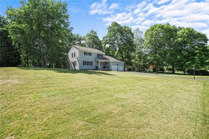 Colonial home with a delightful rocking chair covered front porch on a lovely Cul-De-Sac street. Large rear deck overlooking shy acre, plenty of room for a pool & outdoor entertaining. Entry foyer to sun-filled formal living room, dining room, & uptd half bath. Eat-in-Kitchen just steps away from family room w/skylights & fireplace for warming up during those cold winter months. Great flow for year round entertaining. Access to large deck w/sitting benches from Family rm. Second floor has 4 bedrooms, 2 baths & an additional unfinished room; great space for a storage. Wood floors thru out (except kitchen & bathrooms). Attached 2 Car Garage for easy access to main level of house. Large, unfinished basement just waiting for ideas. Updates: painted rms, family rm HW floor, above gr. oil tank, & newly paved driveway. Close to trains, highways, Hemlock Hill Farm, Blue Mtn. & River Walk for outdoor recreation. If qualified, taxes with STAR savings $17, 915. See Virtual Tour for photos & video.