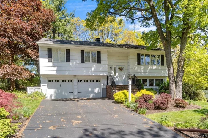 Charm & Sunshine await you in this well maintained bi-level home. Formal living & dining rooms with hardwood floors and crown molding quietly says luxury. The formal dining room opens to the large Trex deck with awning for warm weather enjoyment. The deck overlooks beautiful gardens and breathtaking views. Experience the joy of cooking in this fully equipped kitchen with, granite counter tops, stainless steel appliances, tile back splash and skylight. Comfort and informal characterize the master bedroom. The additional 2 bedrooms are light, bright and roomy. The lower level offers a comfortable family room dominated by the raised hearth fireplace. There is access to the backyard from the lower level. Enjoy the benefits of Woodbury Recreation with a beach & sports facilities. Conveniently located near shopping (Woodbury Commons), schools, highways & major transportation. Updates include; hot water heater (2015), boiler (2009), roof (2010) and central air (2020).