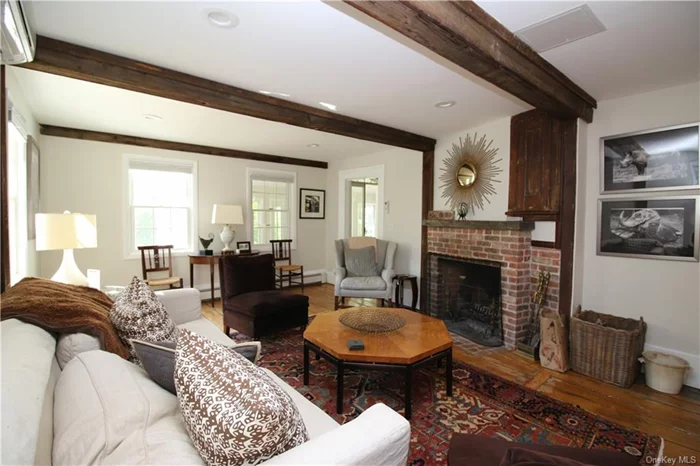 Living Room with fireplace and wide board wood floors