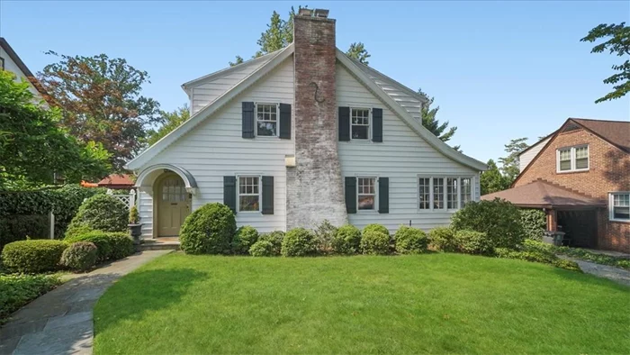 The first thing you&rsquo;ll notice as you approach this charming 1926 colonial are the lovely tree-lined streets paving the way to the close downtown area of White Plains. Enter through the original copper, barrel topped, front door which leads to the mudroom and Living room area that showcases so many great features! A Living room with fireplace; the sunroom marks the perfect spot to relax, work, or let the kids play! Kitchen is updated with granite counters, high-end stainless steel appliances. The dining room opens to a private screened porch. Period details include hand carved newel post, chair rails, original French doors and door hardware. Upstairs are 4 bedrooms, two baths, with a half bath and laundry rounding out the first floor. Modern day conveniences like central air conditioning and in-ground sprinklers. Just a mile to the station for a 38 minute express train to GCT, and just around the corner from Church Street School and parks for recreation. This home is waiting for you!