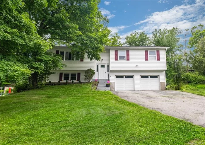 This delightful Bi-Level home is located on a quiet cul-de-sac, in the Monroe-Woodbury Central School District. Minutes away from the world famous Woodbury Commons, bus and train station, this home is the perfect location for any shopper or commuter. The main level of the home offers ample space for entertaining with a kitchen, dining and living room combination that leads to a large trex deck. From the deck you will have an impressive viewing of iconic landscapes. The main level also boasts a primary bedroom with its private full bathroom, along with two additional bedrooms and full bathroom. A large recreation room is situated in a fully finished basement complete with a wood burning fireplace to keep you warm on those cooler days. Additionally the basement also contains a laundry room as well as a 1/2 bath and a bonus room. Come see for yourself all 13 Jackson has to offer.