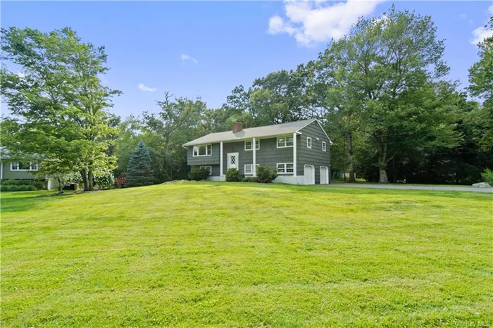 Presented in total move in condition this beautifully renovated 3 bedroom, 2.5 bath Raised Ranch makes a great place to call home. Ideally located on a quiet tree lined Cul-De-Sac on over an acre of level ground with great privacy. The main level offers a wonderful open plan design with a new eat in kitchen with SS appliances, quartz counters & custom cabinets, dining room, large living room with fireplace & picture window. A newly renovated bathroom, master bedroom with half bath & walk in closet plus 2 additional spacious bedrooms. The huge lower level comes complete with a terrific family room, bathroom, den, laundry room & large 2 car garage. All freshly painted & with refinished hardwood flooring, new light fixtures, brand new roof, large deck for entertaining or relaxing on. You wont be disappointed!