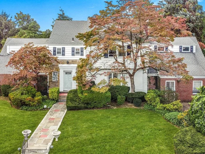 ONE OF A KIND STATELY BRICK COLONIAL -  This 4, 000 square foot five bed, six bath home is nestled in the bucolic Lincoln Park section of Yonkers . The expansive landscaped yard and slate patio areas are truly a spectacular oasis perfect for outdoor gatherings and large enough for an inground pool.  This property sits on an oversized 100 by 110 lot.  You enter the home into a grand foyer which opens to a generous living room, adjacent formal dining connected to spacious updated kitchen with breakfast room, sunken entertainment room with bar, half bath and walk in closet.  Second level consists of four substantial bedrooms and three full baths. The massive primary suit includes walk in closet, dressing room with wall of storage, full bath and oversized jacuzzi.  Lower level, which adds an additional 1, 000 square feet of living space, can be accessed by two separate entrances and includes another eat in kitchen, gigantic recreation room, wine cellar and separate fully contained in-law suite or office with private entrance.  This 1939 brick charmer retains many original period details, including hardwoods throughout, coffered ceilings, archways, and moldings.  Amenities include central air, two car driveway, updated mechanicals and closets galore with walk-up attic for storage or added living space.  Conveniently located near shopping, transportation, schools and houses of worship.  A TRUE MUST SEE !!!