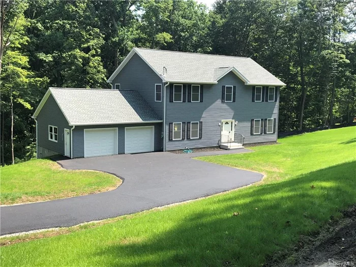 Newer 3, 000 sq. ft. colonial home with spacious rooms, 9&rsquo; ceilings and an open layout on 4.5+ acres of wooded land. The first floor consists of an entry foyer with 2 double closets, formal Dining Rm and an open floor plan with Living Rm, Family Rm, Breakfast Area (both w/sliders to 15x30 deck) and Kitchen with stainless appliances and granite countertops. The 1/2 bath, laundry area and access to the 26 x 26 attached garage complete this level. The second floor contains a spacious Master BR with walk-in closet and LARGE master bath, plus 2 additional Bedrooms + den -- all with walk-in closets! -- hall bath and a large open area. Hardwood floors throughout entire house. 1500 sq. ft. walkout basement with sliders to an 8-person hot tub and outdoor TV (included). Close to Metro North, Rt. 9, shopping, etc. Septic engineered for 4 BR.