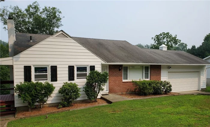 Looks can be deceiving! This house offers a vaulted living room ceiling with large large bay window, eat-in-kitchen, up stairs to three bedrooms and hall bath. Down to lower level that includes an additional 532 SF not included above, sliding glass door to deck that expands entire length of house. Enjoy quiet evenings overlooking large backyard. Hidden storage spaces galore! Two car garage also offers additional space to be creative for the hobbyist or let your imagination flow.